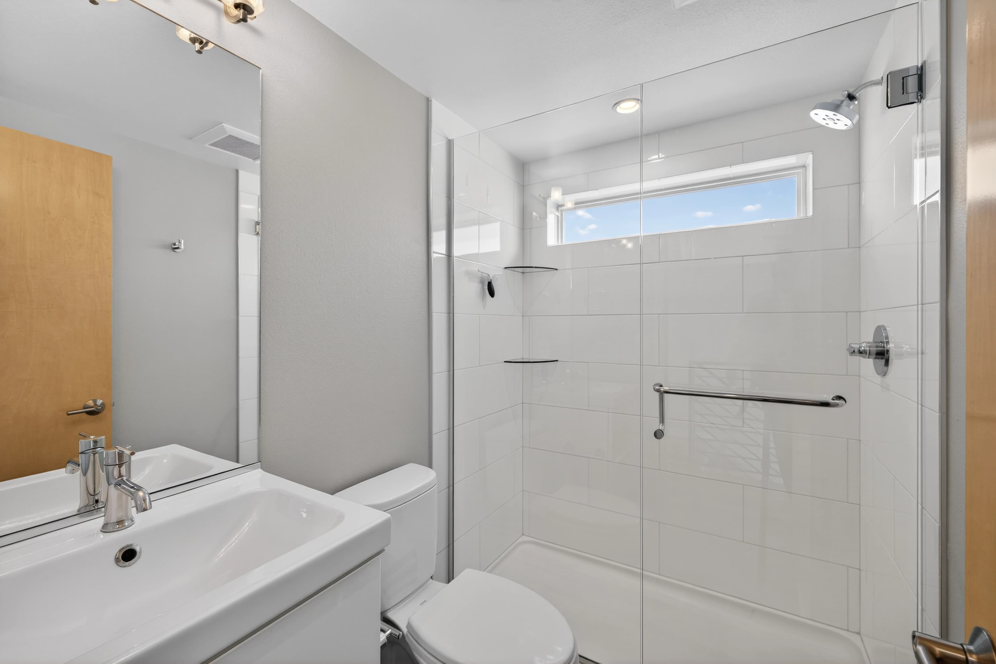 Bathroom with glass shower detail.